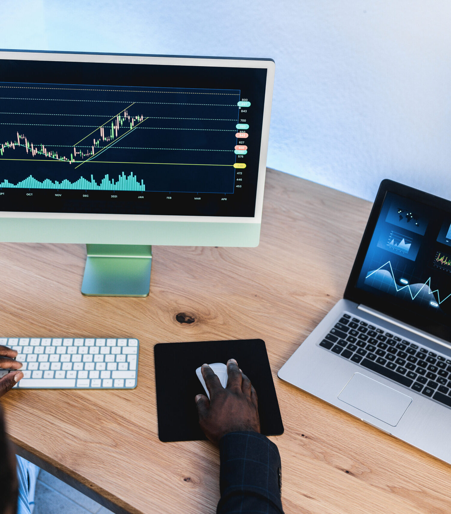 African trader studying stock market at home office - Focus on right hand